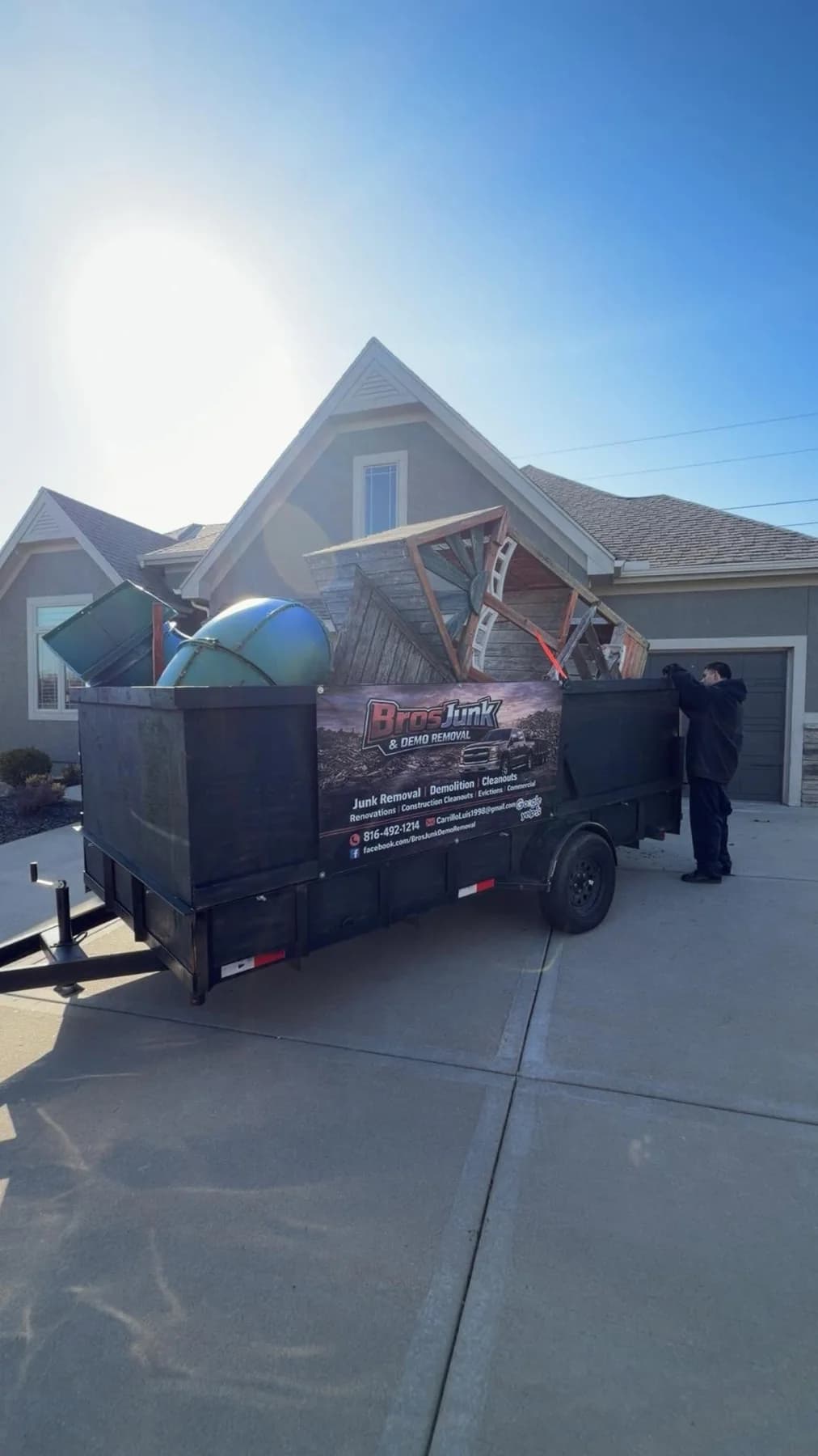 Trailer loaded with household junk
